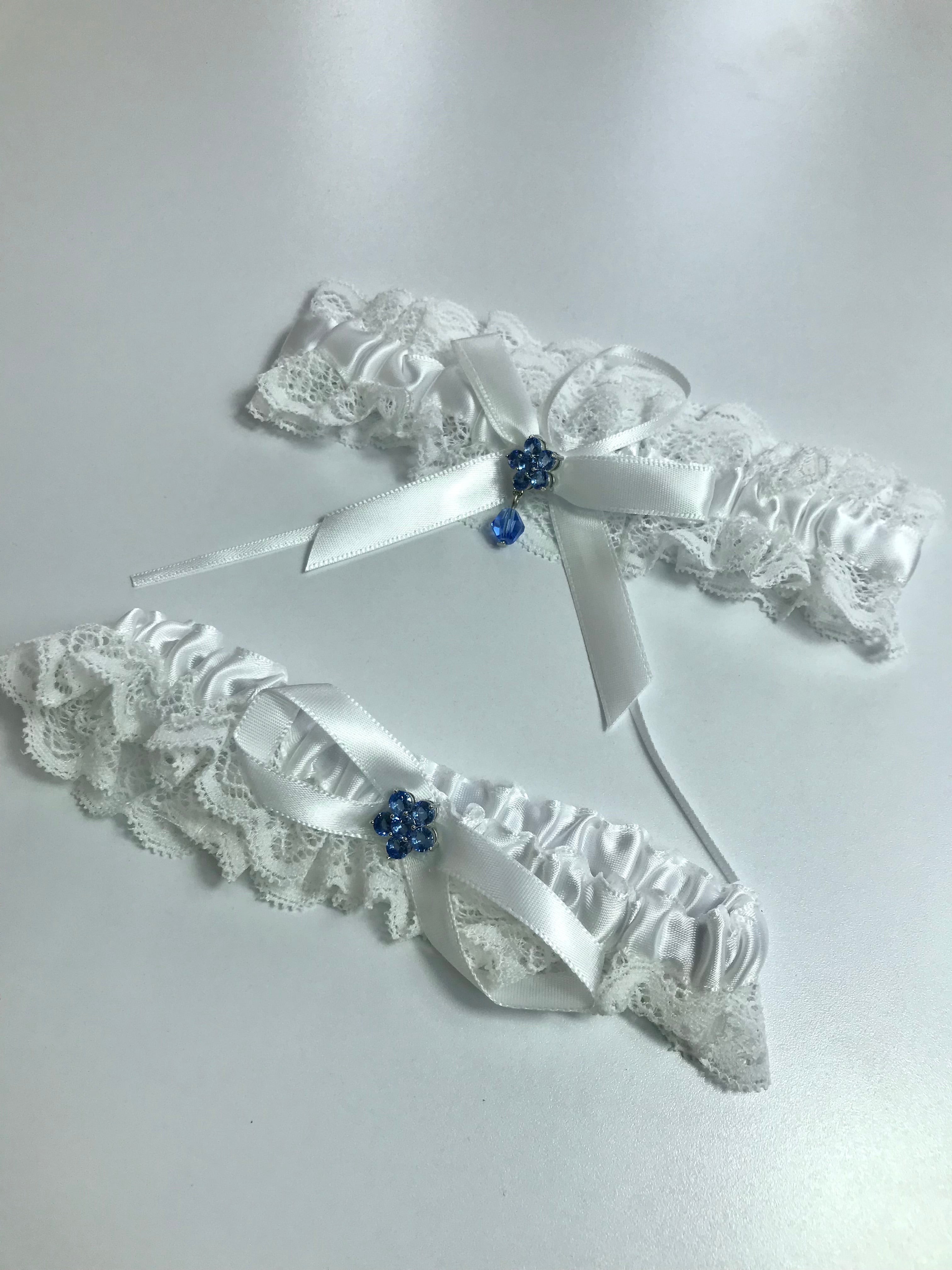Liguero de encaje y pedrería azul